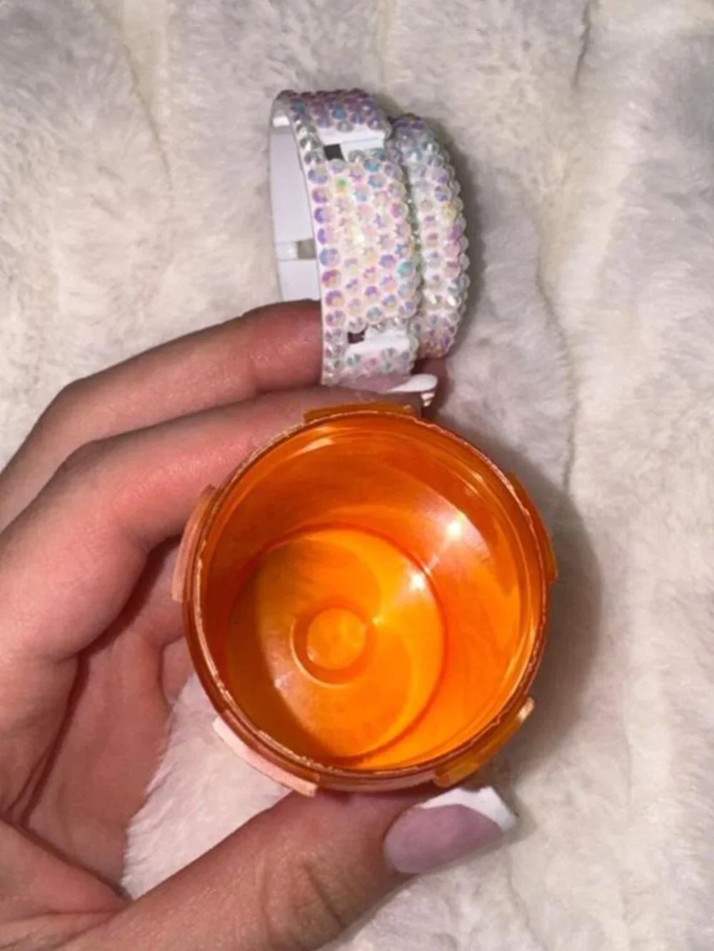 Orange rhinestone bottle with silver cap